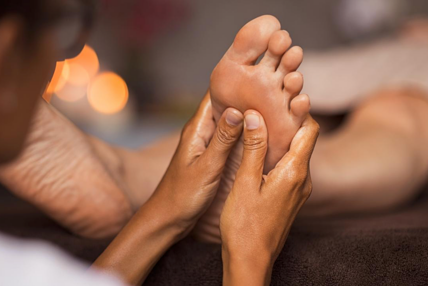 Feet are being massaged. This represents the feeling roofers experience when wearing a comfortable magnetic roofing shoe.