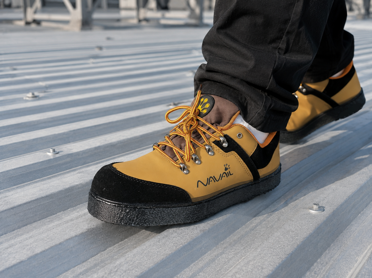 Worker wearing Magnetic footwear on a steel roof